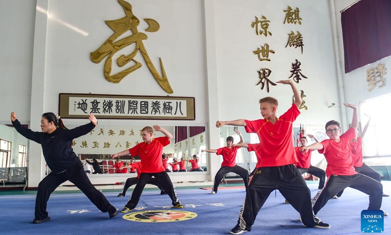 A coach leads Russian students to practice Bajiquan, a powerful style of Kung Fu, at a training base in Qingxian County, Cangzhou City, north China's Hebei Province, June 25, 2025. A Bajiquan training base in Qingxian County welcomed this year's first batch of international students from Russia, who will learn the traditional Bajiquan and experience the Chinese martial arts culture. (Photo: Xinhua)