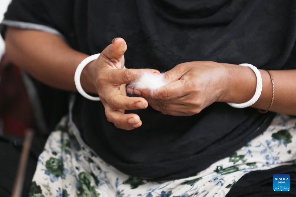 A weaver shows the cotton Phuti Karpas at a muslin workshop in Dhaka, Bangladesh, on May 24, 2025. Bangladesh is undertaking a national effort to revive its legendary Dhaka muslin fabric, once hailed as woven air for its ethereal lightness and intricate craftsmanship during the Mughal era. (Photo: Xinhua)