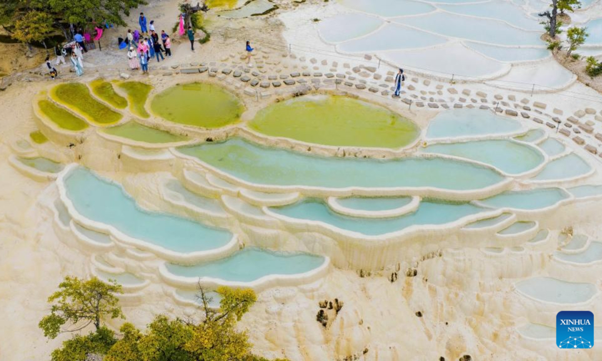 An aerial drone photo shows a view of Baishuitai in Sanba Township, Shangri-la, the Deqen Tibetan Autonomous Prefecture, southwest China's Yunnan Province, June 26, 2025. Formed by the sediments of high calcium carbonate in spring waters, Baishuitai is one of the biggest limestone terraces in China. (Xinhua/Pu Chao)