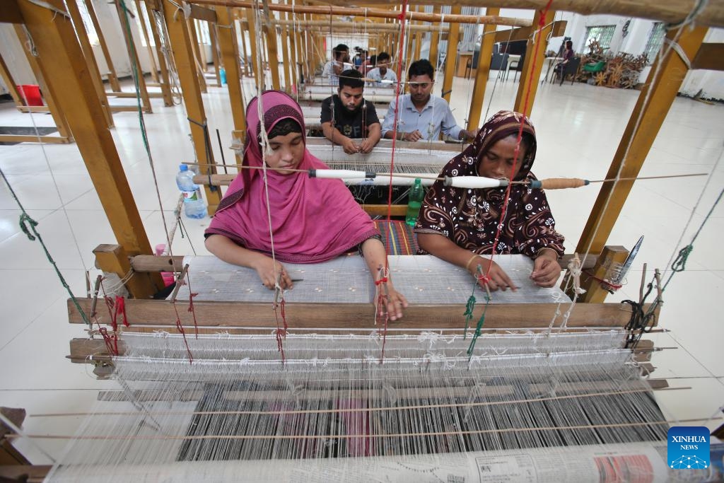 Weavers work at a muslin workshop in Dhaka, Bangladesh, on May 24, 2025. Bangladesh is undertaking a national effort to revive its legendary Dhaka muslin fabric, once hailed as woven air for its ethereal lightness and intricate craftsmanship during the Mughal era. (Photo: Xinhua)