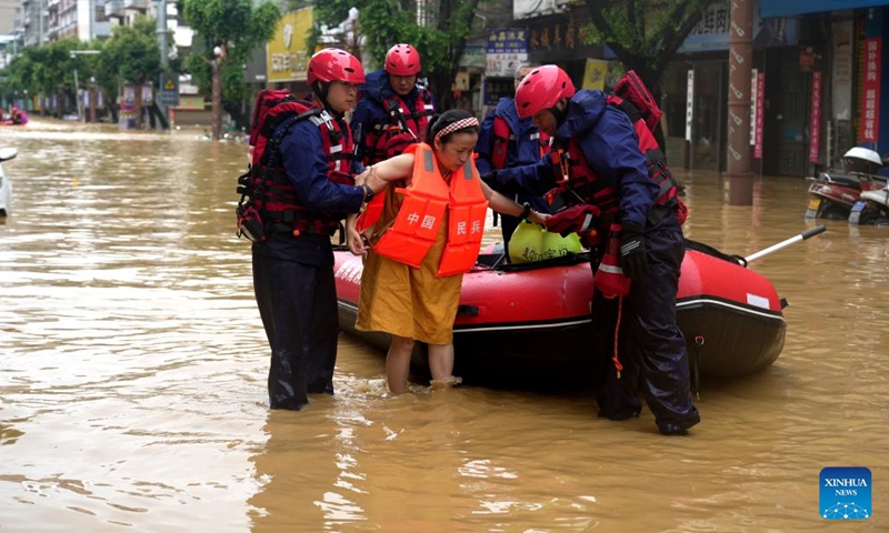 Rescuers evacuate a resident from flood-affected area in Rongjiang County, southwest China's Guizhou Province, June 24, 2025. Continuous heavy rainfall and upstream inflows have triggered severe flooding in two counties of Guizhou Province in southwest China, prompting mass evacuations. (Photo: Xinhua)