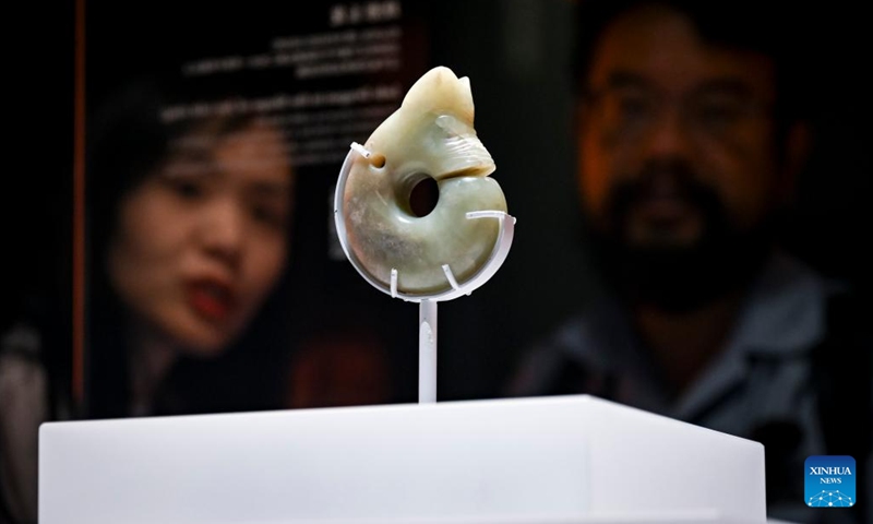 Visitors appreciate an exhibit during a media preview of the exhibition titled Legends of Dragon: The Ancient Civilization of Hongshan Culture at the Shanghai Museum East in east China's Shanghai, June 25, 2025. The exhibition will open here on June 26. The exhibition is jointly organized by twenty domestic museums and archaeological institutions, showcasing over 300 cultural relics. Hongshan culture is an important prehistoric archaeological culture dating back roughly 5,000 to 6,000 years. (Photo: Xinhua)