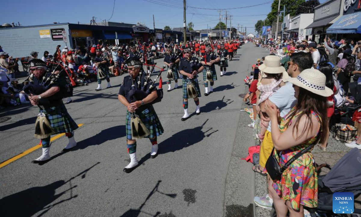 A pipe band marches during a Canada Day Parade in Richmond, British Columbia, Canada, on July 1, 2025. (Photo by Liang Sen/Xinhua)