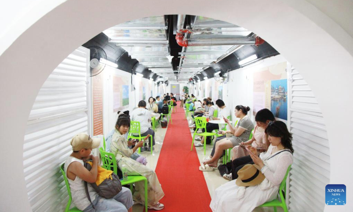Residents enjoy leisure time in an air-raid shelter in Nanjing, east China's Jiangsu Province, July 2, 2025. Due to hot weather this summer, Nanjing has opened 22 air-raid shelters for free, providing local residents with various social and leisure services. (Photo by Liu Jianhua/Xinhua)