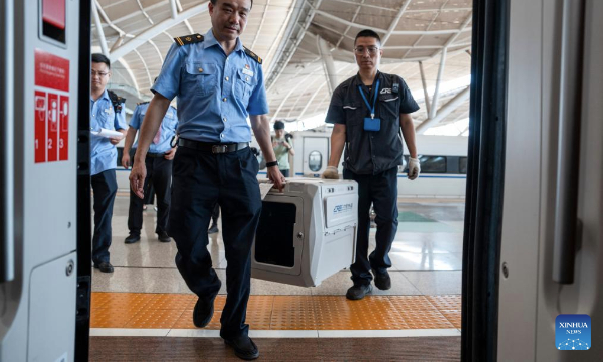 Staff members transport a pet transport case to a train at Wuhan Railway Station in Wuhan, central China's Hubei Province, July 1, 2025. On the first day of this year's summer travel rush, some qualified domesticated cats and dogs boarded on bullet trains accompanying their owners in Wuhan on Tuesday, as the pilot pet consignment service on high-speed railways expanded its scope from June 20.

Each traveler is allowed to bring one healthy pet weighing no more than 15 kilograms and standing no taller than 40 centimeters at the shoulder, accompanied by a valid quarantine certificate, according to China State Railway Group Co., Ltd. (Xinhua/Wu Zhizun)