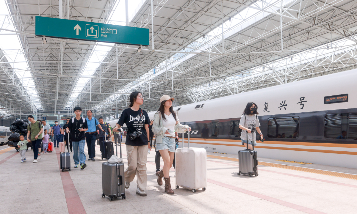 Passengers walk on the platform at the Beijing North Railway Station in Beijing on June 30, 2025. This year, the national railway's summer travel season runs from July 1 to August 31. During the 62-day period, the railway system is expected to carry 953 million passenger trips, an increase of 5.8 percent year-on-year, with an average of 15.37 million trips per day. Photo: VCG