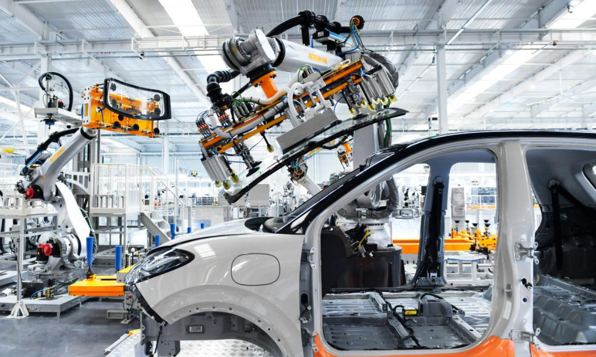 Robots install windshields for cars at an intelligent workshop of Chinese automobile manufacturer SAIC-GM-Wuling in Liuzhou, south China's Guangxi Zhuang Autonomous Region, May 9, 2024. (Xinhua/Jin Haoyuan)