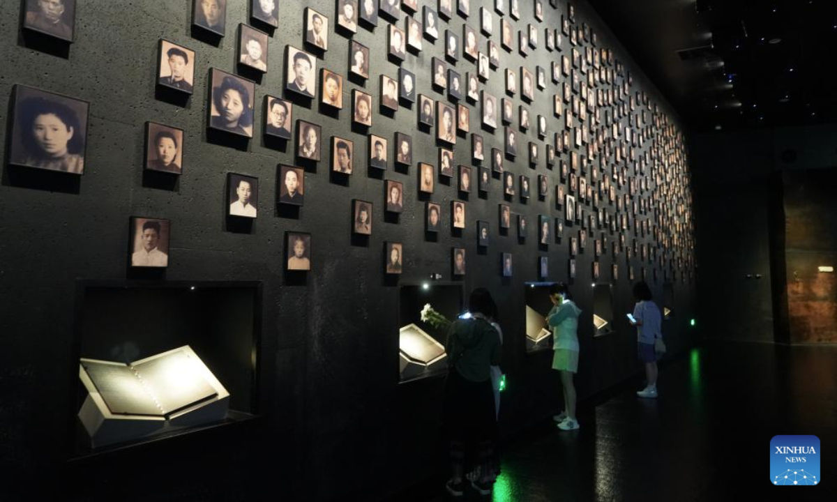 People visit the Memorial Hall of the Victims in Nanjing Massacre by Japanese Invaders in Nanjing, east China's Jiangsu Province, July 2, 2025. A lights out ceremony for two survivors of the Nanjing Massacre who passed away this year was held here on Wednesday. On a photo wall featuring survivors of the Nanjing Massacre, the lightboxes of Liu Guixiang and Xie Guiying were dimmed off, and their colored photos then turned to black and white.

With the passing away of Liu and Xie earlier this year, the number of living registered survivors has decreased to 26. (Photo by Liu Zhenrui/Xinhua)