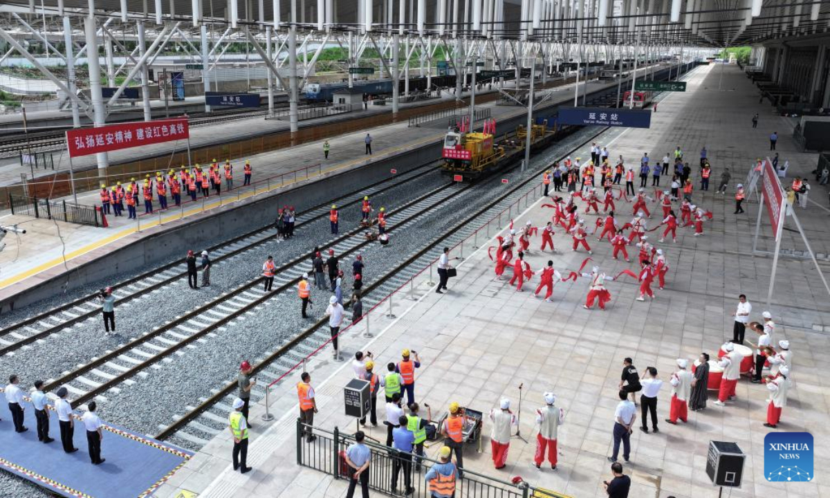 This drone photo taken on July 1, 2025 shows the high-speed railway track-laying completion ceremony at the Yan'an Railway Station in Yan'an, northwest China's Shaanxi Province. Track-laying for a high-speed railway linking Xi'an and Yan'an in Shaanxi completed on Tuesday.

Once launched, the new railway will shorten the trip between Xi'an and Yan'an from 2.5 hours to around one hour. (Xinhua/Zhang Bowen)