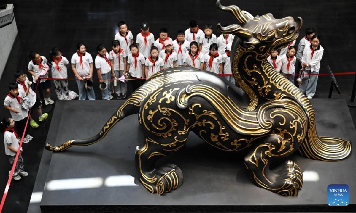 Students visit a museum featuring Han Dynasty (202 BC-220 AD) tombs to spend their summer time in Xuyi, east China's Jiangsu Province, July 2, 2025. The museum of Han king's mausoleum at Dayun Mountain in Xuyi stages several featured exhibitions in this summer holiday to attract people to visit and learn about history knowledge. (Xinhua/Ji Chunpeng)
