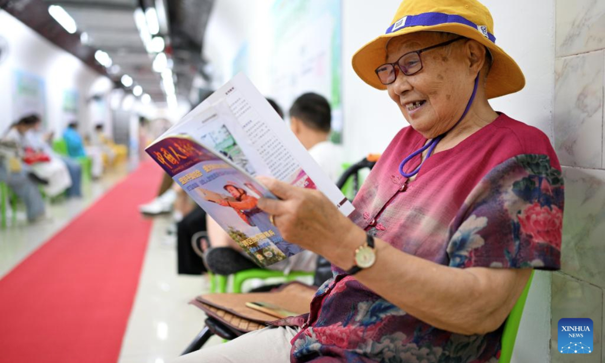 A citizen reads in an air-raid shelter in Nanjing, east China's Jiangsu Province, July 2, 2025. Due to hot weather this summer, Nanjing has opened 22 air-raid shelters for free, providing local residents with various social and leisure services. (Photo by Fang Dongxu/Xinhua)