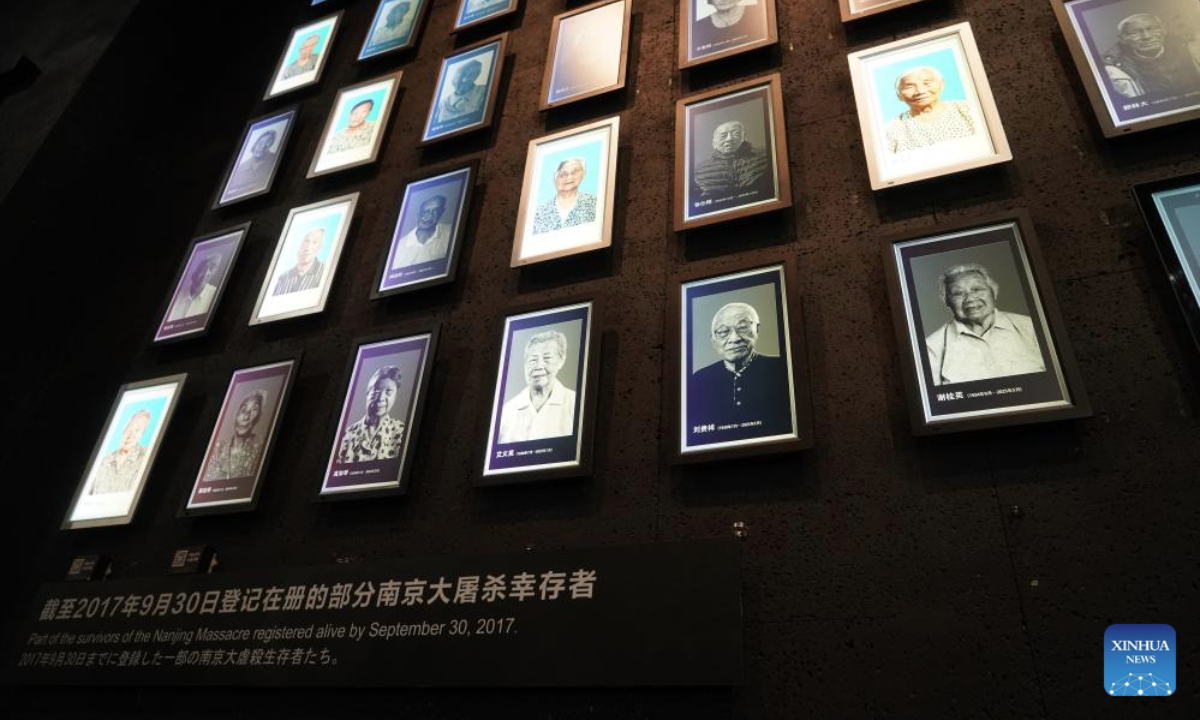 This photo taken on July 2, 2025 shows the lightboxes of Liu Guixiang (2nd R, bottom) and Xie Guiying (1st R, bottom) on a photo wall featuring survivors of the Nanjing Massacre at the Memorial Hall of the Victims in Nanjing Massacre by Japanese Invaders in Nanjing, east China's Jiangsu Province. A lights out ceremony for two survivors of the Nanjing Massacre who passed away this year was held here on Wednesday. On a photo wall featuring survivors of the Nanjing Massacre, the lightboxes of Liu Guixiang and Xie Guiying were dimmed off, and their colored photos then turned to black and white.

With the passing away of Liu and Xie earlier this year, the number of living registered survivors has decreased to 26. (Photo by Liu Zhenrui/Xinhua)