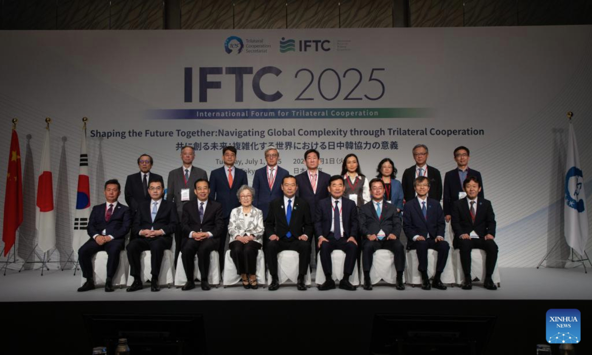 Participants pose for a group photo before the opening ceremony of the 2025 Trilateral Cooperation Forum in Tokyo, Japan, July 1, 2025. (Xinhua/Yue Chenxing)