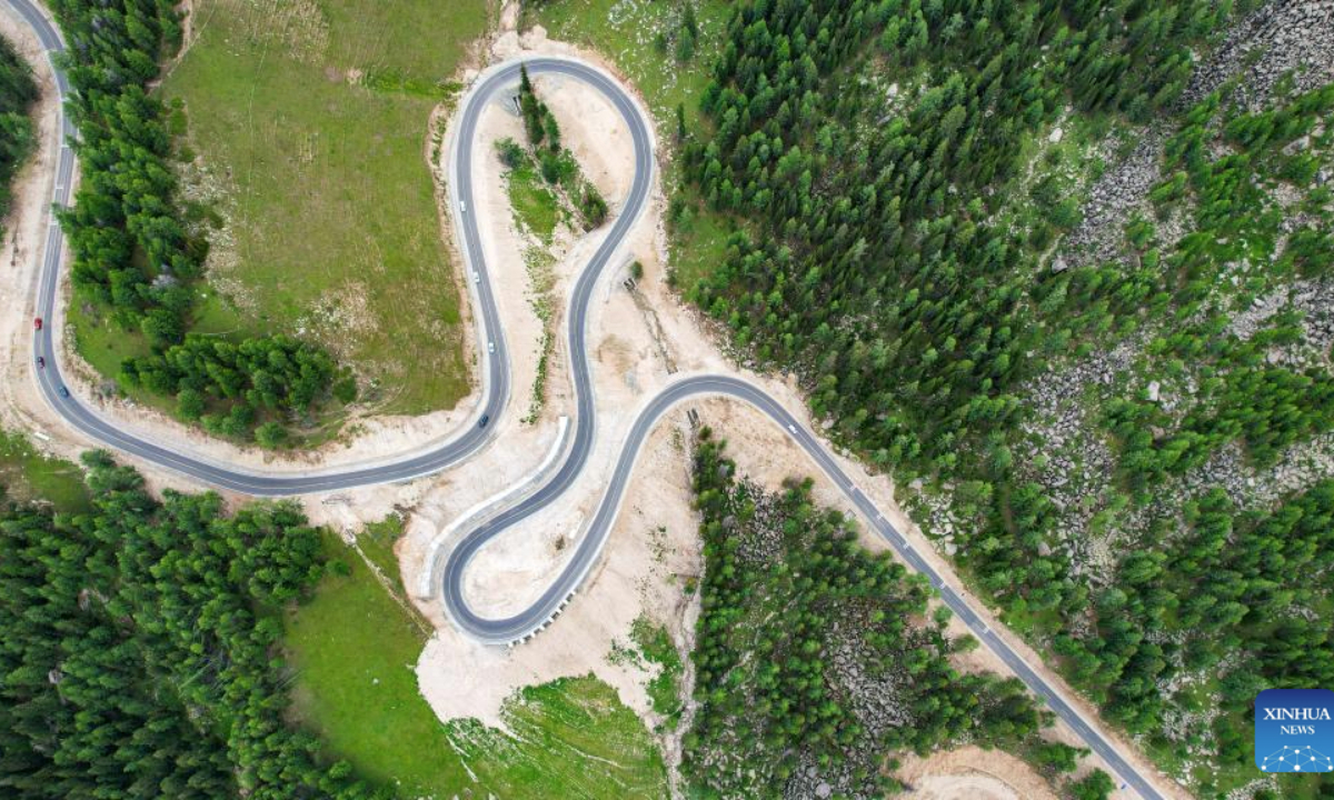 An aerial drone photo taken on June 30, 2025 shows the Altay-Hemu highway in northwest China's Xinjiang Uygur Autonomous Region. The 209.45-kilometer-long highway linking Altay City and Hemu Village opened officially on Monday, connecting a number of tourist destinations. (Photo by Wang Youbo/Xinhua)