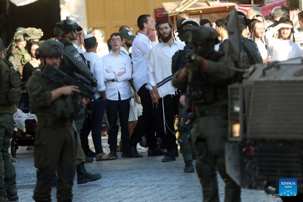 Members of Israeli forces secure the streets for Israeli settlers in the Old City of Hebron in the southern West Bank, on June 28, 2025. (Photo: Xinhua)