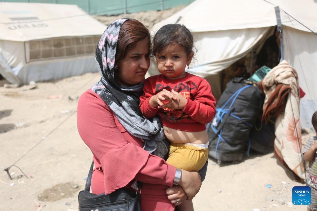 Newly arrived Afghan refugees settle in a temporary camp in Kabul, Afghanistan, June 29, 2025. The United Nations High Commissioner for Refugees (UNHCR) on Saturday raised the alarm over a surge in the number of Afghans returning from Iran under harsh conditions, cautioning that large-scale returns could exacerbate Afghanistan's already fragile situation. (Photo: Xinhua)