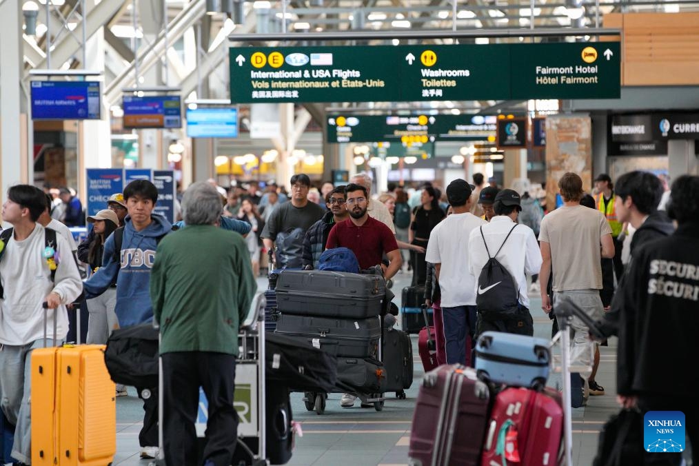 Passengers are seen at the departure hall of Vancouver International Airport in Richmond, British Columbia, Canada, June 28, 2025. Vancouver International Airport is set for its busiest-ever summer, with over 6.7 million travelers expected from June 15 to September 2, the airport authority said. (Photo: Xinhua)