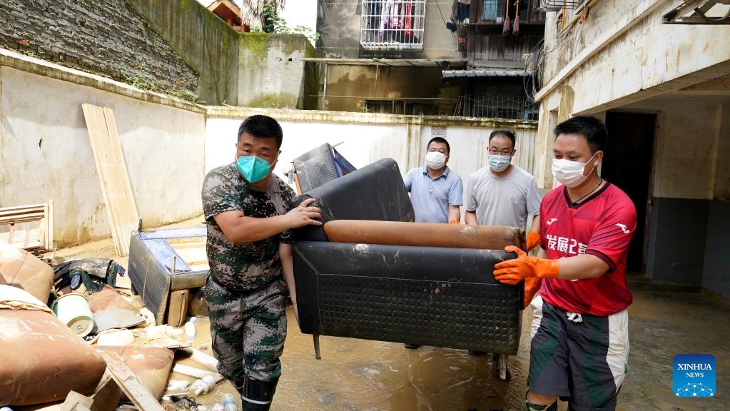 Volunteers work in the flood-stricken Rongjiang County, southwest China's Guizhou Province, June 29, 2025. Heavy flooding has returned to Rongjiang County in southwest China's Guizhou Province, prompting local authorities to re-activate the highest-level emergency flood response, effective from 12:30 p.m. Saturday. Since flooding began, Rongjiang, with a population of 385,000, has received prompt rescue efforts from both authorities and volunteers. (Photo: Xinhua)