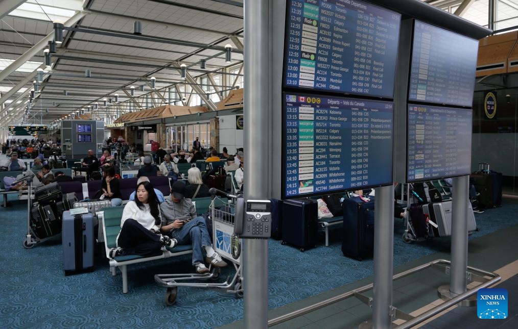 Passengers wait in the departure hall of Vancouver International Airport in Richmond, British Columbia, Canada, June 28, 2025. Vancouver International Airport is set for its busiest-ever summer, with over 6.7 million travelers expected from June 15 to September 2, the airport authority said. (Photo: Xinhua)