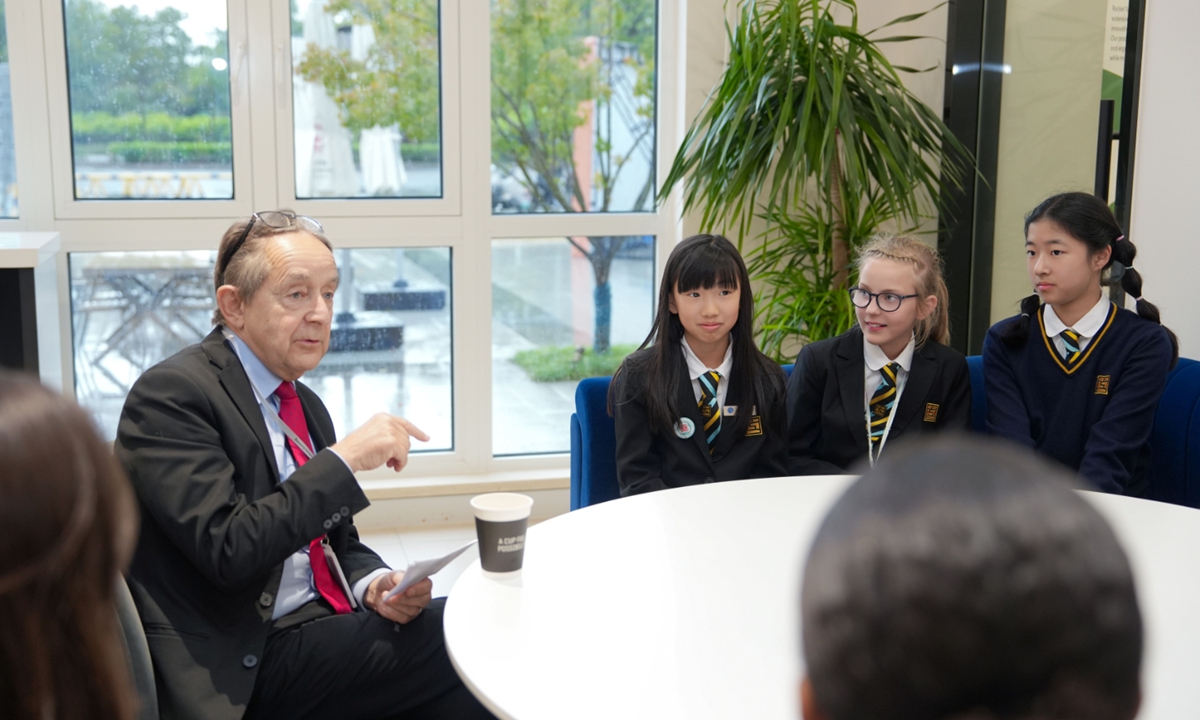 Sir Anthony Seldon (left), founding director of Wellington College Education, meets with student representatives at the Hiba Academy Nantong in East China's Jiangsu Province in October 2024. Photo: Courtesy of Wellington College China