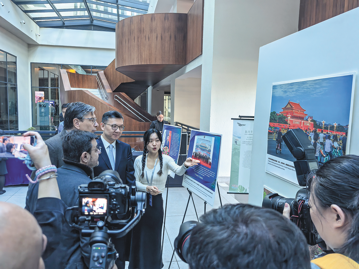 Global Times President and Editor-in-Chief Fan Zhengwei (third left) and guests view photos at the Moving forward together across mountains and seas: a decade of China-LAC sustainable cooperation exhibition in Rio de Janeiro, Brazil, on June 25, 2025. Photo: Zhang Qi/GT