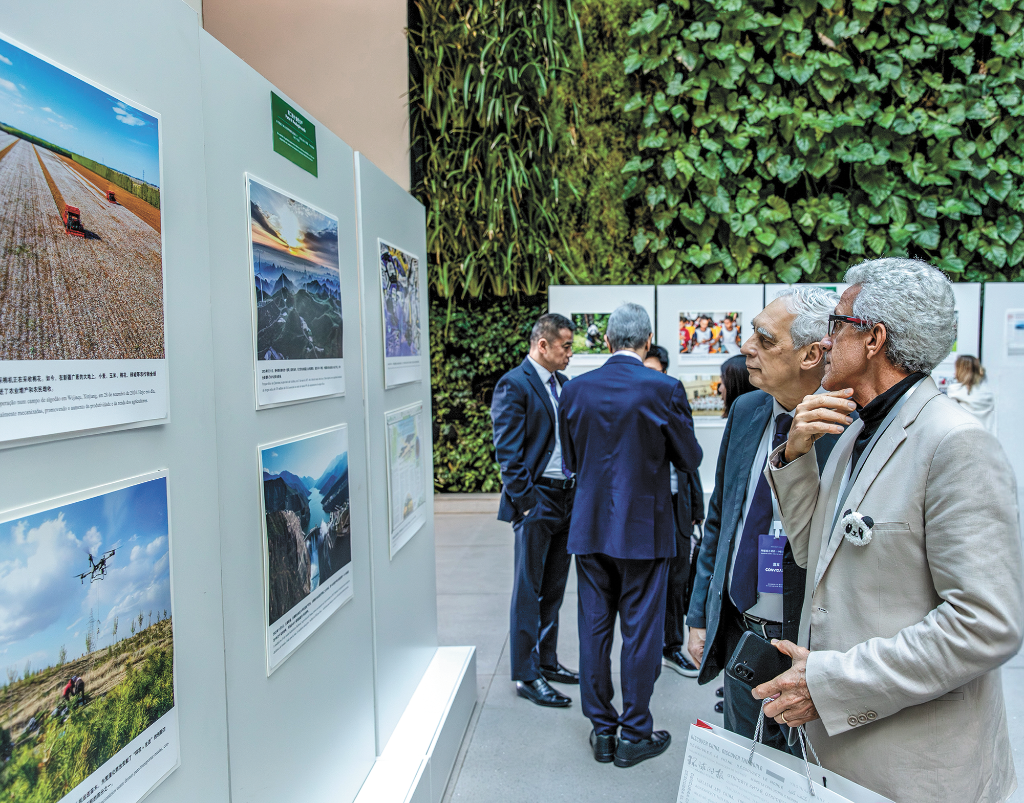 Guests view photos at the exhibition in Rio de Janeiro, Brazil, on June 25, 2025. Photo: Courtesy of Bill Vianna