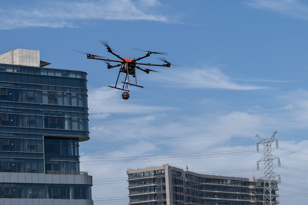 A drone is engaged in a precision-throwing event, showcasing its skills in rescue operations during a competition held in Jinhua, East China's Zhejiang Province on July 3, 2025. The competition featured four tasks-precision flying, precision throwing, fire-situation reconnaissance, and material delivery. Photo: VCG