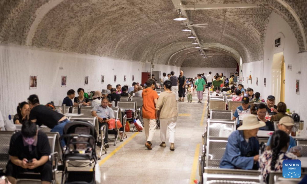 Residents cool off at an air-raid shelter in Hangzhou, east China's Zhejiang Province, July 3, 2025. Starting from July 1, the city's cooling centers transformed from air-raid shelters were open to the public free of charge for two months. Hangzhou issued an orange heat alert on Thursday. (Xinhua/Jiang Han)