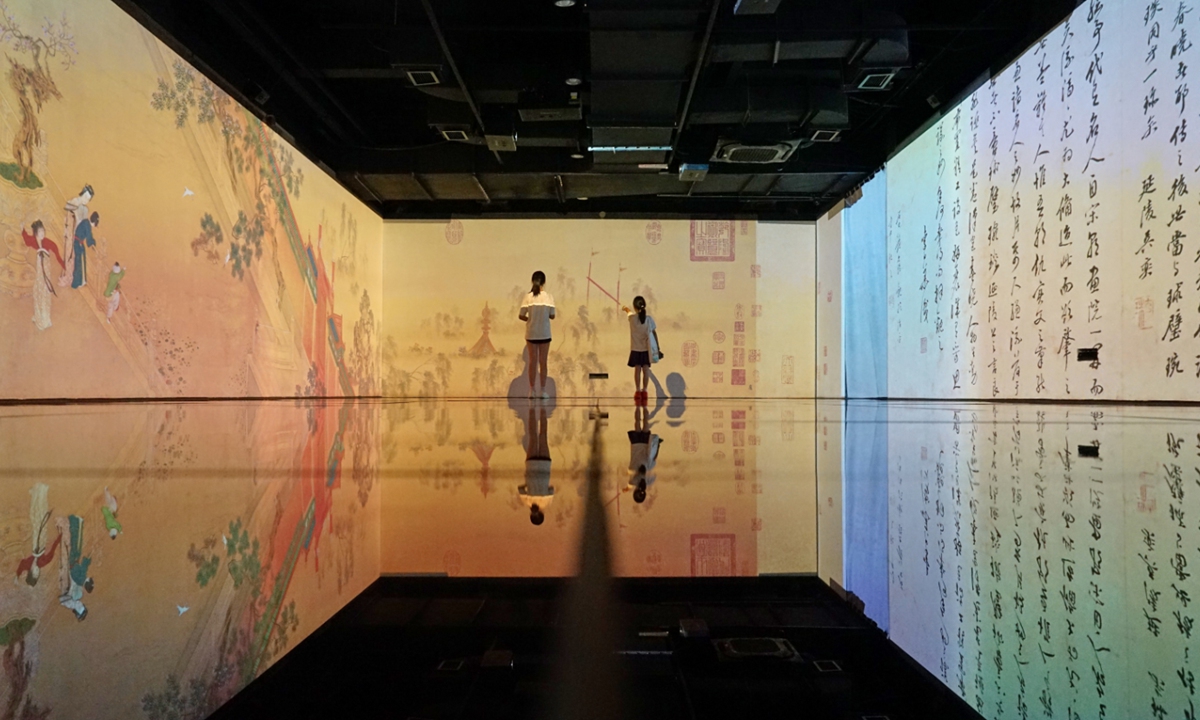 Children engage in learning at a library's metaverse reading experience hall in Jiaxing, East China's Zhejiang Province, on July 3, 2025. With summer vacation in full swing, the experience hall at the Jiaxing Library has attracted many students to immerse themselves in knowledge. Photo: VCG