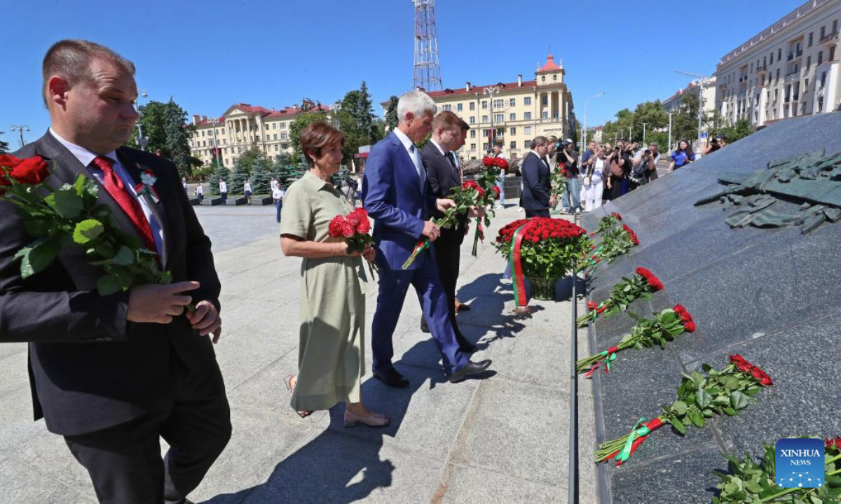 People pay tribute to the monument in Victory Square to mark Belarus Independence Day in Minsk, Belarus, on July 3, 2025. Belarus celebrated its most important national holiday on Thursday, commemorating a significant historical moment of liberation during World War II. (Photo by Henadz Zhinkov/Xinhua)