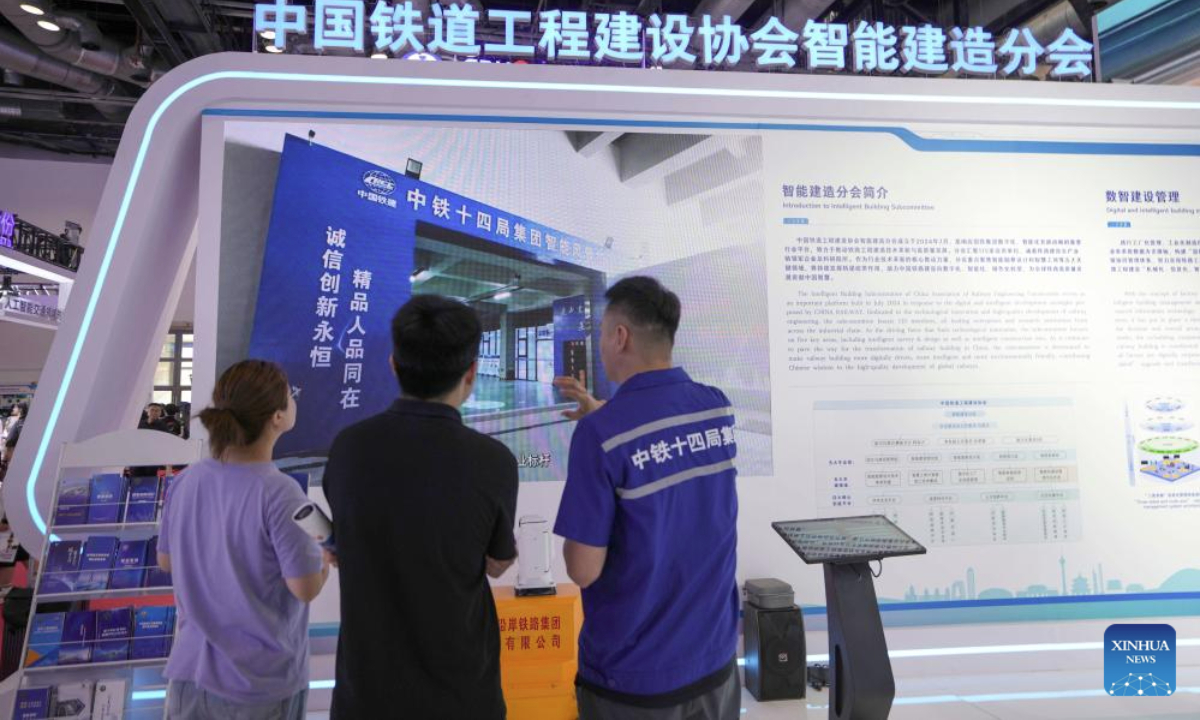 People visit the Modern Railways 2025 exhibition in Beijing, capital of China, July 8, 2025. The exhibition kicked off here on Tuesday, showcasing advanced railway technologies and equipments from all over the world. (Xinhua/Xing Guangli)