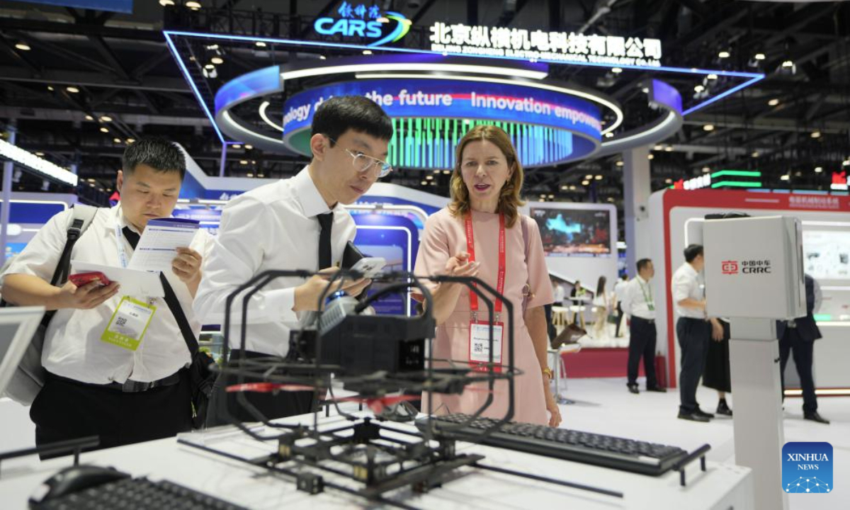 People visit the Modern Railways 2025 exhibition in Beijing, capital of China, July 8, 2025. The exhibition kicked off here on Tuesday, showcasing advanced railway technologies and equipments from all over the world. (Xinhua/Xing Guangli)