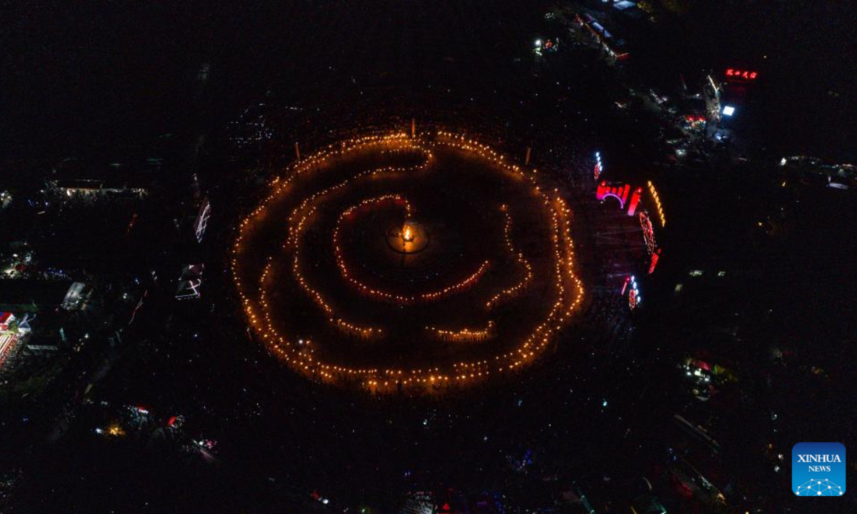 An aerial drone photo shows a scene during a celebration for the Torch Festival of Yi ethnic group held in Shuicheng District of Liupanshui, southwest China's Guizhou Province, July 18, 2025. Celebrations for the Torch Festival of Yi ethnic group kicked off on Friday at a tourist resort in Shuicheng District of Liupanshui, attracting tourists from across the country. A series of related activities will also take place here on or before Aug. 17. (Xinhua/Tao Liang)