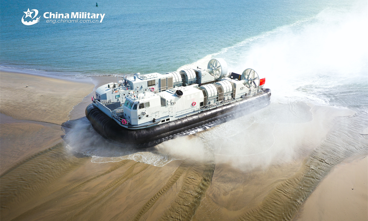 A landing craft air cushion (LCAC) attached to a landing ship group with the navy under the Chinese PLA Southern Theater Command dashes onto the shore during a maritime training exercise. (eng.chinamil.com.cn/Photo by Zhang Xueyan)
