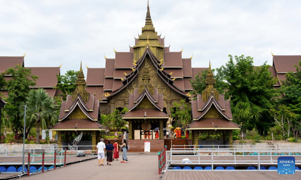Tourists visit the Lao Art Museum in Vientiane, Laos, July 13, 2025. The Lao Art Museum features an array of traditional Lao woodcarvings, highlighting the intricate craftsmanship that is a cornerstone of the nation's cultural identity. It also provides a platform to showcase creativity across generations, promoting sustainability, environmental awareness, and cultural preservation. (Photo by Kaikeo Saiyasane/Xinhua)