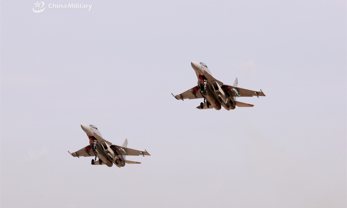 Two J-16 multi-role fighter jets attached to an aviation brigade under the Chinese PLA Air Force take off in formation during a recent flight training exercise. (eng.chinamil.com.cn/Photo by Zhang Weishan)