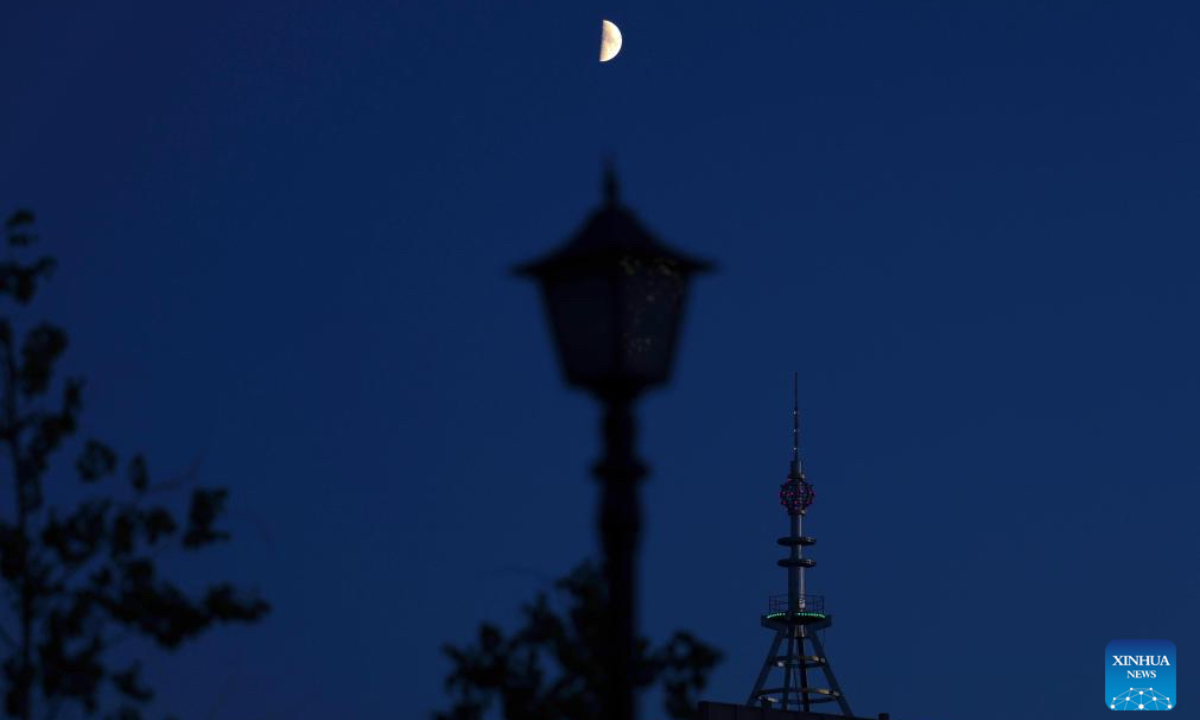 This photo taken on Aug. 1, 2025 shows the first quarter moon in the sky in Heihe City, northeast China's Heilongjiang Province. (Photo by Qian Boyu/Xinhua)