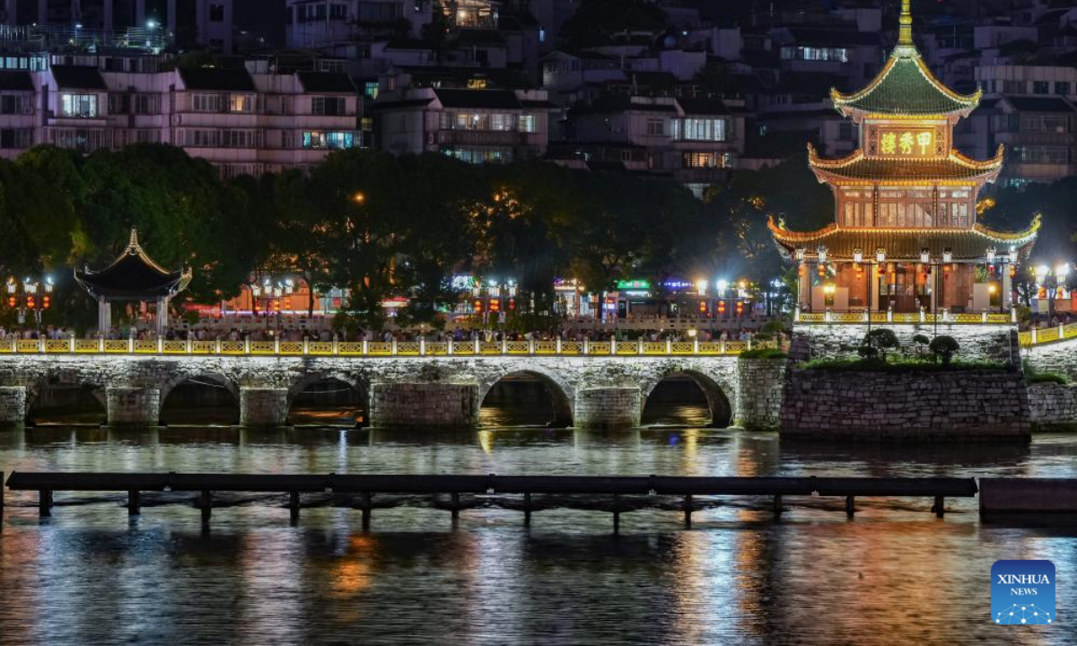 An aerial drone photo taken on July 30, 2025 shows people visiting Jiaxiu tower scenic area in Guiyang, capital of southwest China's Guizhou Province. Guizhou Province, with its cool climate and rich tourism resources, attracts tourists from all over the country during the peak summer travel season. (Xinhua/Liu Xu)