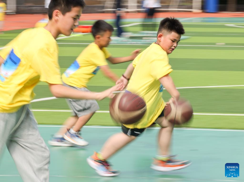 Children participate in a dribbling game in Beijing, capital of China, July 5, 2025. A sports meeting for children with asthma was held here on Saturday. (Photo: Xinhua)
