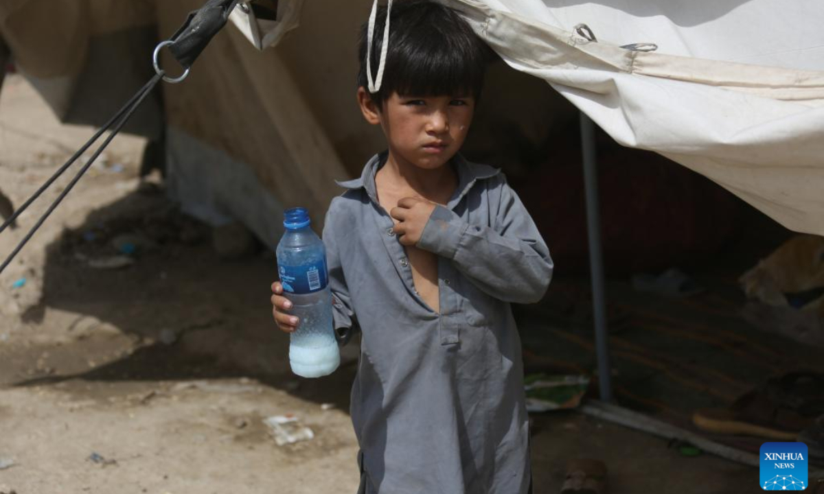 This photo taken on July 9, 2025 shows an Afghan child at a makeshift refugee camp in Kabul, Afghanistan. More than 2,600 Afghan refugee families, the majority of whom were from Iran, returned home in a single day on Tuesday, reported the state-run Bakhtar news agency on Wednesday. (Photo by Saifurahman Safi/Xinhua)