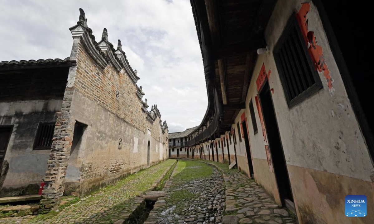 This photo taken on June 19, 2025 shows restored stone walls in Yangcun Town of Longnan, east China's Jiangxi Province. Longnan City in southern Jiangxi is home to 376 Hakka walled complexes, a special architectural type, accounting for more than 70 percent of all such structures in Gannan (southern Jiangxi Province). The whole structure of the building resembles a small fortified city, containing halls, storehouses and living areas. In recent years, Longnan City has launched a systematic preservation initiative, investing 150 million yuan (about 20.89 million U.S. dollars) to protect and restore these historical complexes. Up until now, the repair of 92 Hakka walled villages has been completed. These sites have transcended their roles as cultural relics, evolving into engines powering the city's cultural tourism and rural revitalization. In the first four months of this year, Longnan received 3.33 million tourists. (Xinhua/Wan Xiang)