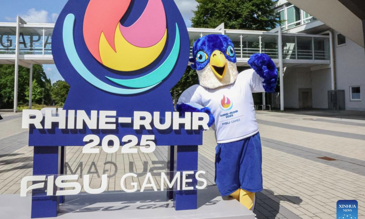The Rhine-Ruhr 2025 FISU World University Games mascot Wanda poses with the logo in Essen, Germany, July 15, 2025. (Xinhua/Zhang Fan)