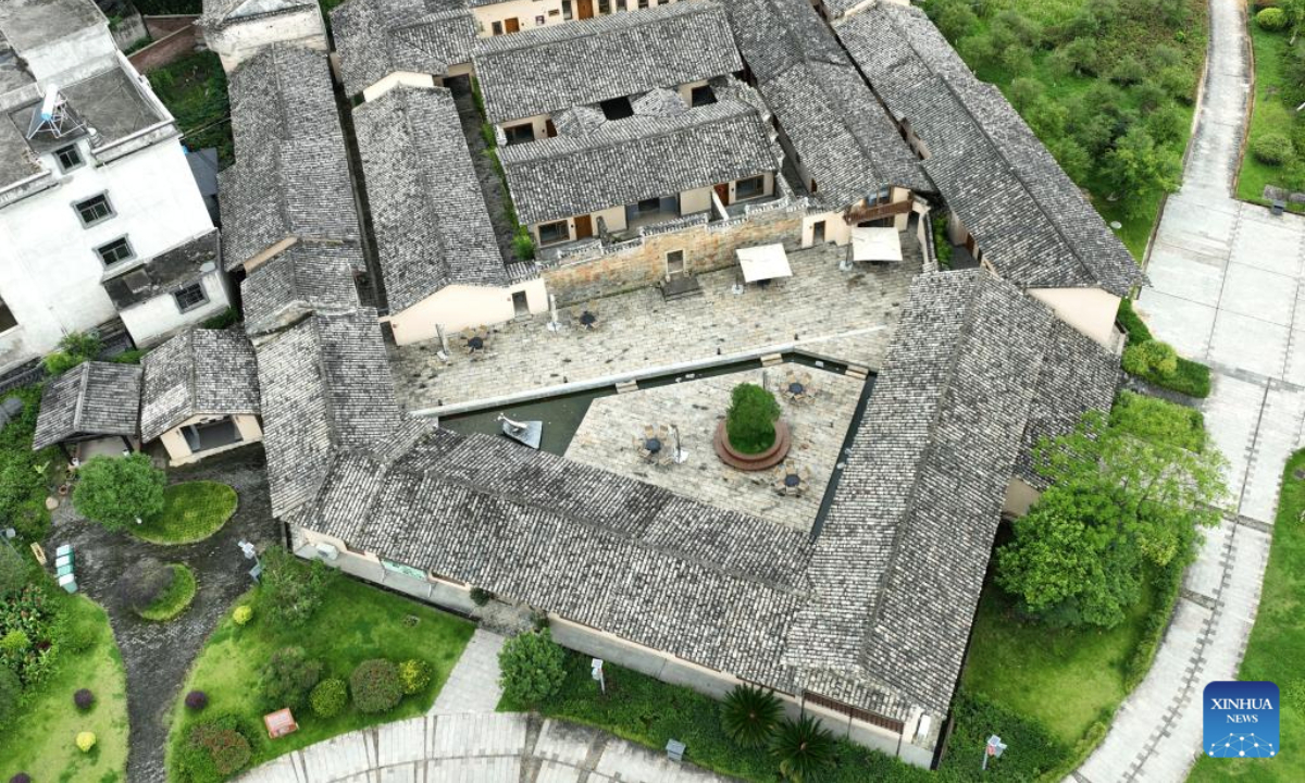 An aerial drone photo taken on June 19, 2025 shows a Hakka walled complex in Guanxi Town of Longnan, east China's Jiangxi Province. Longnan City in southern Jiangxi is home to 376 Hakka walled complexes, a special architectural type, accounting for more than 70 percent of all such structures in Gannan (southern Jiangxi Province). The whole structure of the building resembles a small fortified city, containing halls, storehouses and living areas. In recent years, Longnan City has launched a systematic preservation initiative, investing 150 million yuan (about 20.89 million U.S. dollars) to protect and restore these historical complexes. Up until now, the repair of 92 Hakka walled villages has been completed. These sites have transcended their roles as cultural relics, evolving into engines powering the city's cultural tourism and rural revitalization. In the first four months of this year, Longnan received 3.33 million tourists. (Xinhua/Wan Xiang)
