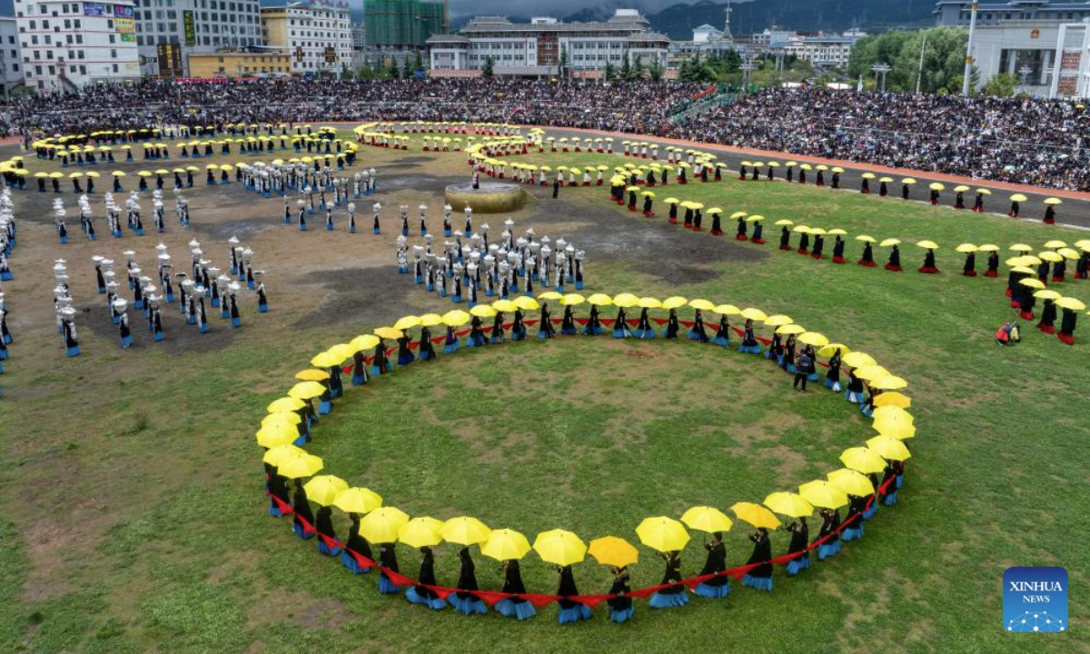 An aerial drone photo taken on July 22, 2025 shows a scene at the opening ceremony of a torch festival in Butuo County, southwest China's Sichuan Province. A traditional torch festival of Yi ethnic group was staged from July 21 to 23 here, which featured various activities including costume displays, campfire party, traditional ethnic sports events, dancing and traditional beauty contest to attract visitors from across the country. (Xinhua/Jiang Hongjing)
