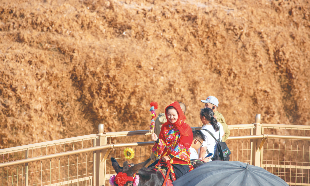 The Hukou Waterfall of the Yellow River near Yan’an, Northwest China’s Shaanxi Province, experiences a sudden surge in water flow due to heavy upstream rainfall on July 29, 2025, creating a rare ‘twin waterfall’ spectacle. Photo: IC