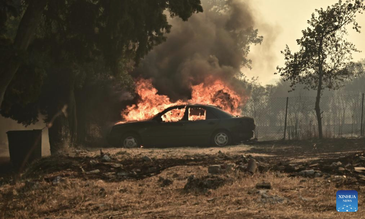 A car is on fire in Drosopigi, East Attica region of Greece, July 26, 2025. Wildfires broke out in many places across Greece on Saturday, due to the extreme heatwaves recently. The Greek government has requested assistance from the European Union Civil Protection Mechanism to combat the fire. (Photo by krioneri tatiana bolari/Xinhua)