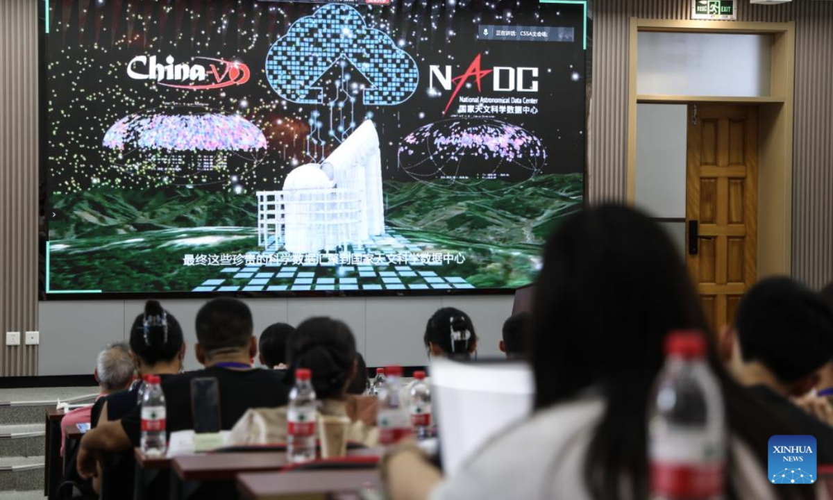 Attendees watch an astronomical science popularization video during the first edition of Citizen Science Summit in Astronomy in Dalian, northeast China's Liaoning Province, July 31, 2025. The event was held here on Thursday, aiming to promote the popularization and public participation of astronomy. (Xinhua/Pan Yulong)