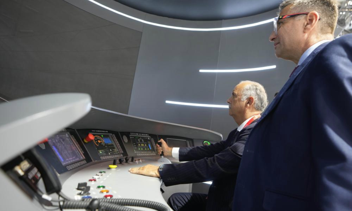 A visitor tries simulated driving of high-speed railway train during the Modern Railways 2025 exhibition in Beijing, capital of China, July 8, 2025. The exhibition kicked off here on Tuesday, showcasing advanced railway technologies and equipments from all over the world. (Xinhua/Xing Guangli)