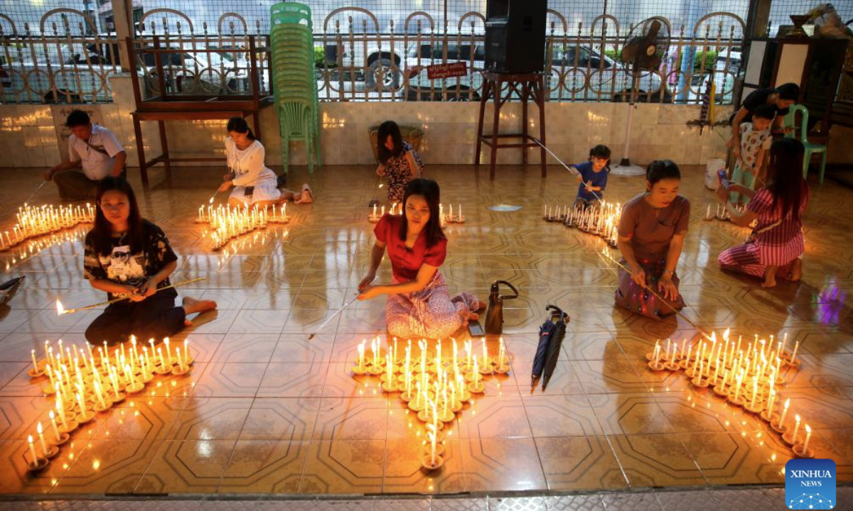 People light candles during celebrations of the full moon day of Warso, the fourth month of Myanmar calendar, at the Koe Htat Gyi Pagoda in Yangon, Myanmar, July 9, 2025. (Xinhua/Myo Kyaw Soe)