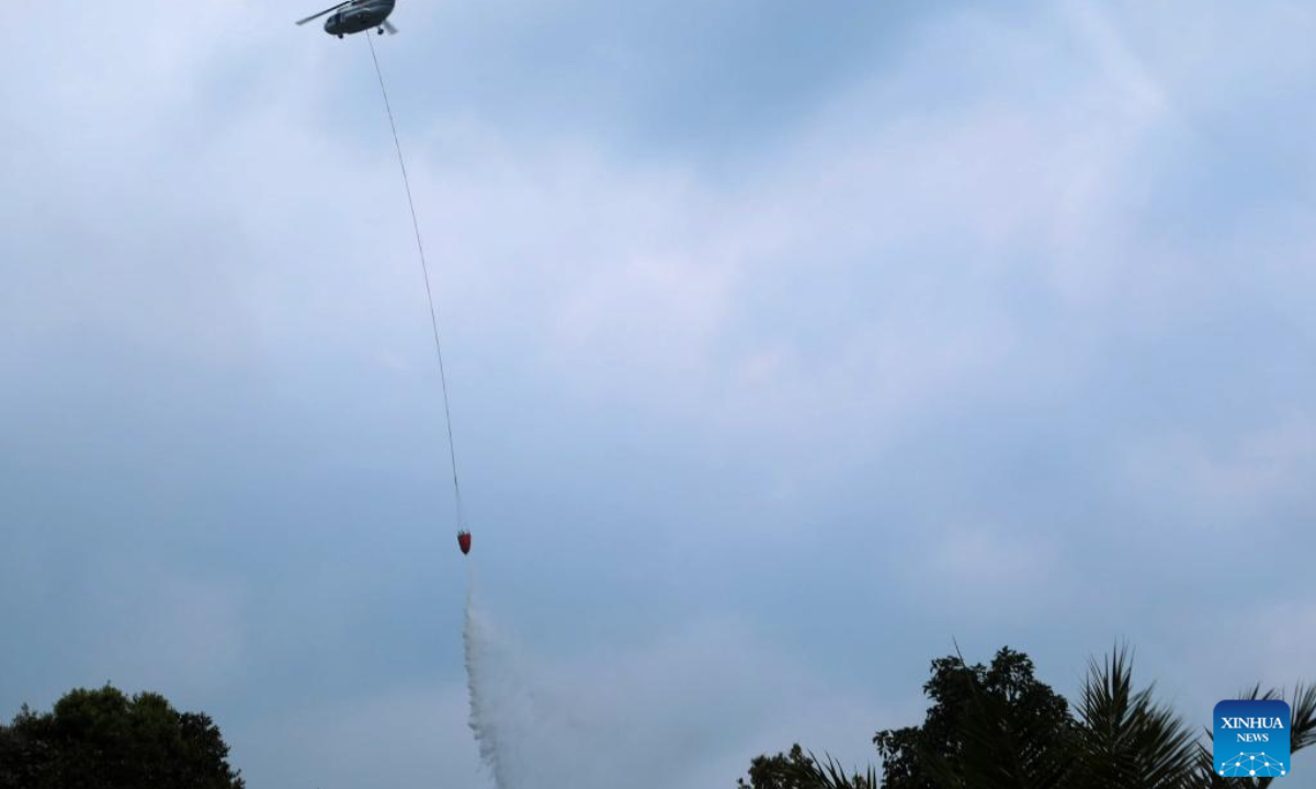 A water bombing helicopter tries to extinguish a forest and land fire at Rokan Hulu regency in Riau province, Indonesia on July 24, 2025. Indonesian authorities were accelerating efforts to tackle forest and land fires, particularly in Riau province and other regions across Sumatra Island in the country's western territories.
According to the Coordinating Ministry for Political and Security Affairs, a spike in hotspots was detected in Riau between July 19 and 20, with smoke potentially drifting to neighboring countries. (Indonesia's National Disaster And Mitigation Agency/Handout via Xinhua)